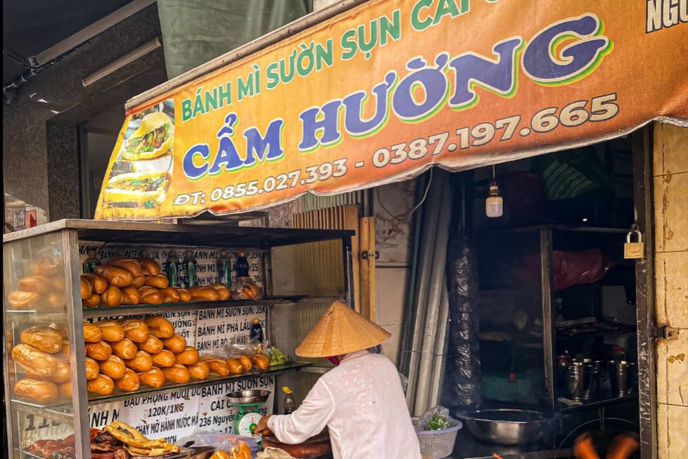 On Nguyen Than Hien Street, District 4, Banh Mi Suon Sun Ba Huong is easy to spot by its smoky charcoal grill
